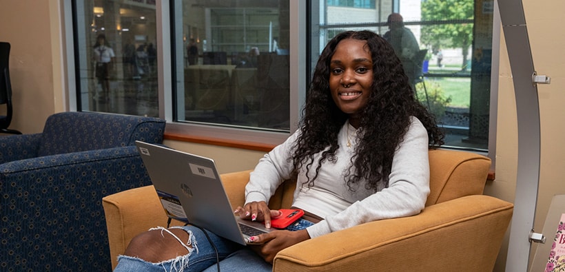 Student in Chair with Computer